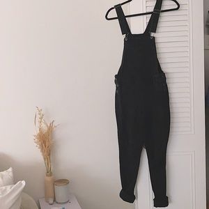 black denim overalls, skinny boot cut